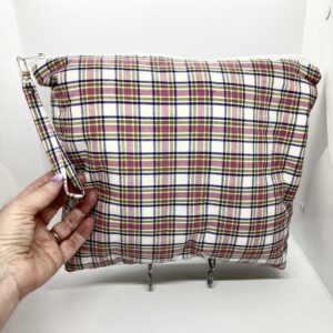 Eleven by thirteen inch project bag handcrafted with pink plaid upcycled fabric. Has a zipper closure with an accessible handle attached to the zipper.