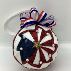 3" red, white and blue ornament made using the Prairie Pinwheel pattern from Ornament Girls.
