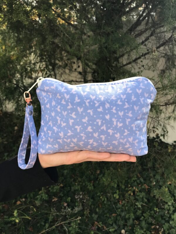Lavender Leaves small bag with a wristlet attached to the zipper.