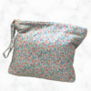 Eleven by thirteen inch project bag handcrafted with pale blue with butterflies upcycled fabric. Has a zipper closure with an accessible handle attached to the zipper.