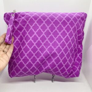 Eleven by thirteen inch project bag handcrafted with a fuschia diamond pattern. Has a zipper closure with an accessible handle attached to the zipper.