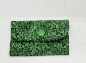 Mini wallet in medium green calico fabric with a light green snap.