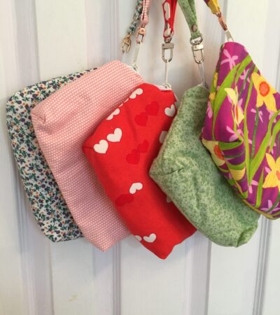 Selection of 6" x 9" bags hanging on a hook on the back of a door.